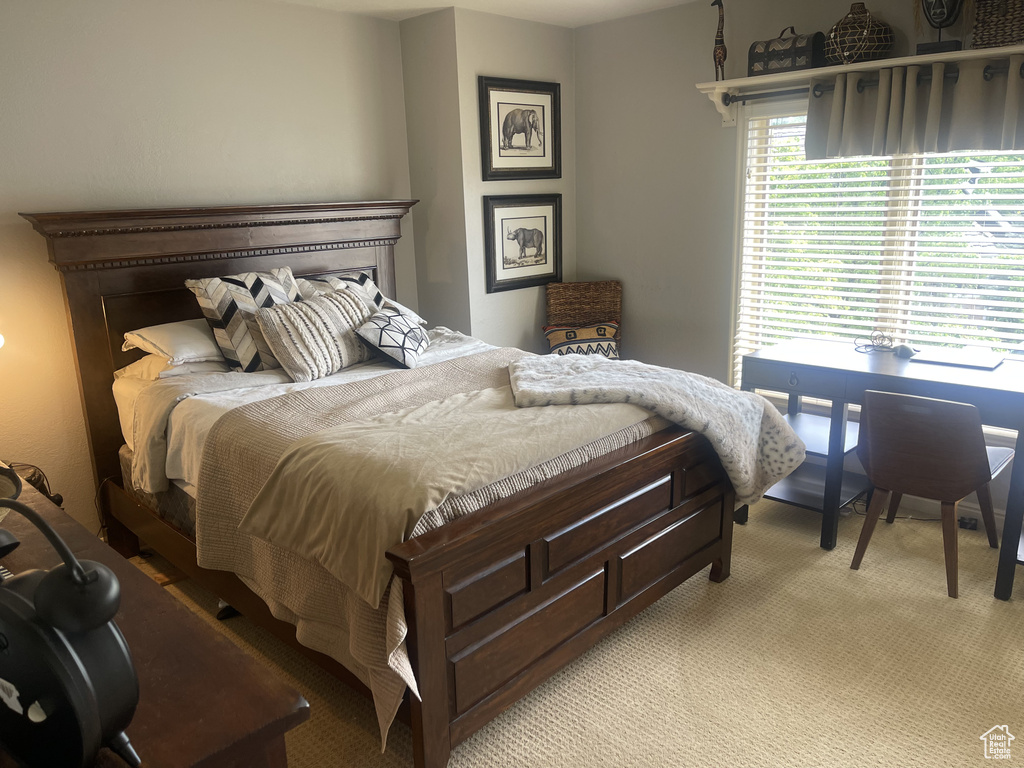 Bedroom with light colored carpet