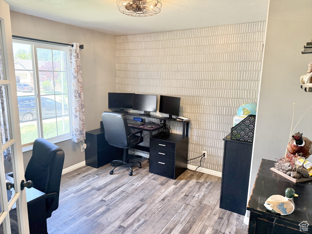Office area with wood finished floors and baseboards