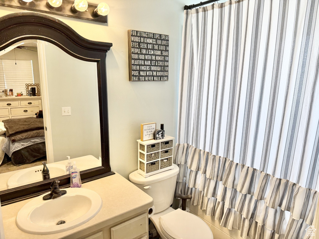 Bathroom with toilet and vanity