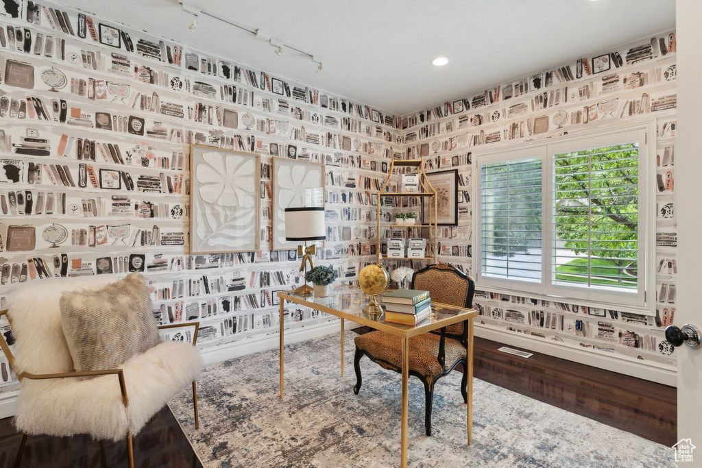 Home office featuring track lighting, recessed lighting, wood finished floors, and wallpapered walls