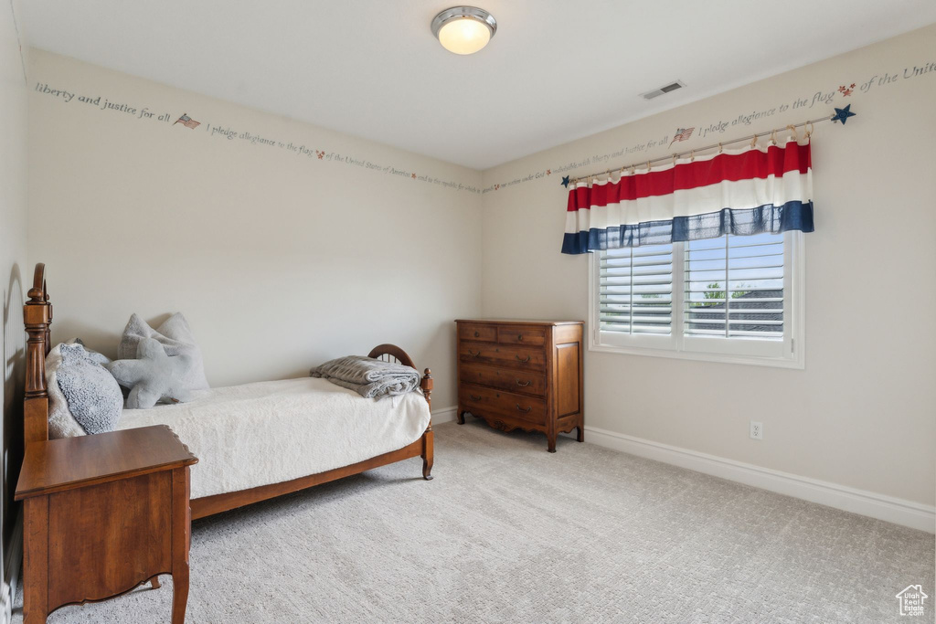 Carpeted bedroom with baseboards