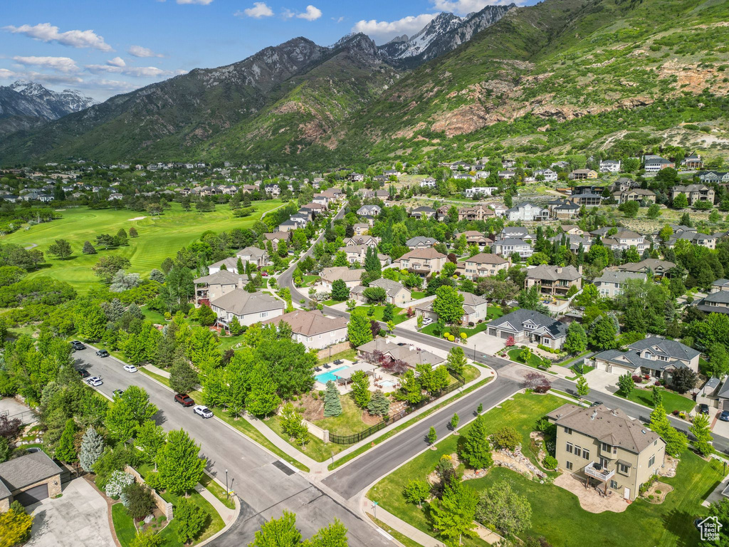 Aerial perspective of suburban area with a mountainous background