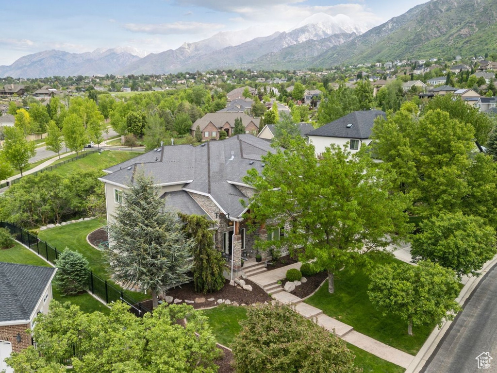 Aerial perspective of suburban area featuring a mountainous background