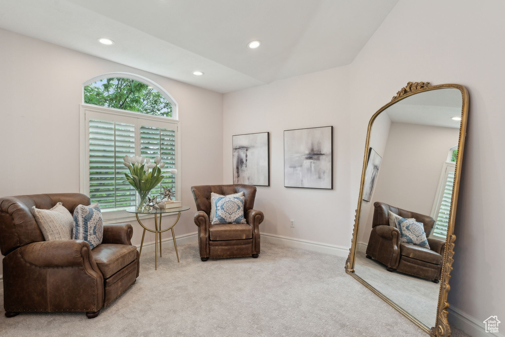 Living area with recessed lighting, carpet, and baseboards