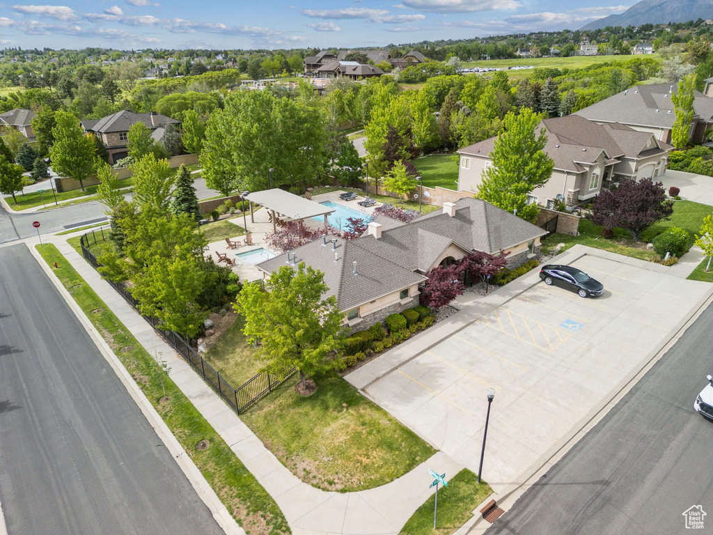 Aerial view of residential area featuring a pool