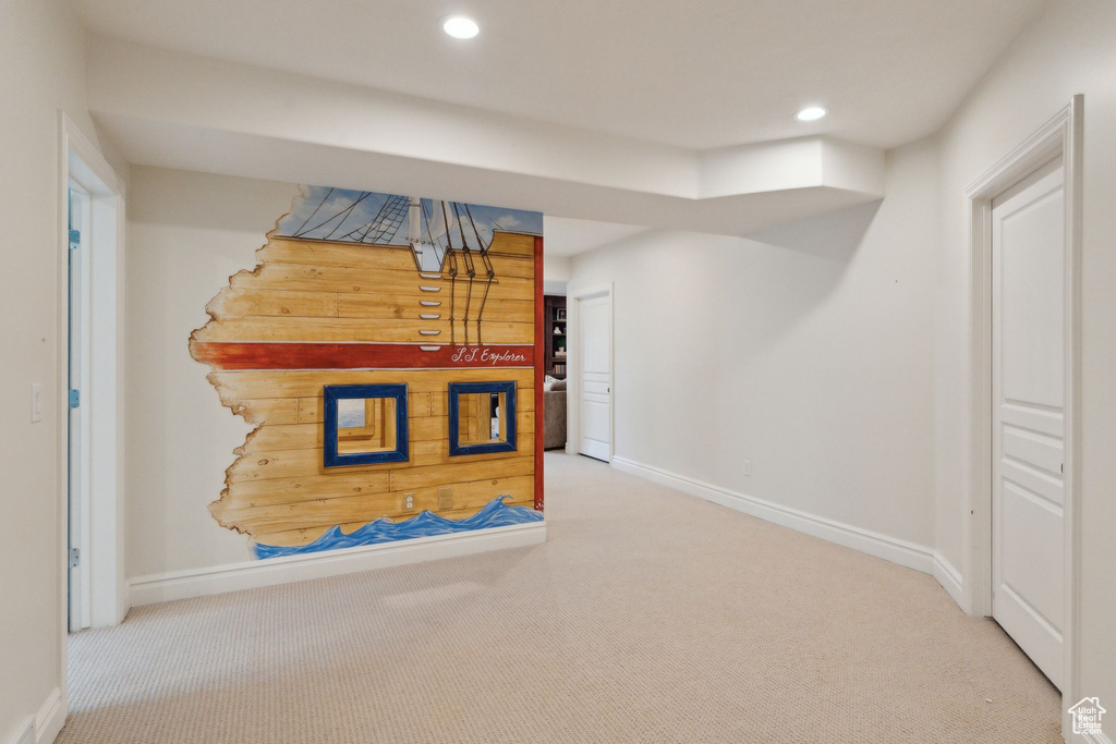 Hall featuring carpet, baseboards, and recessed lighting