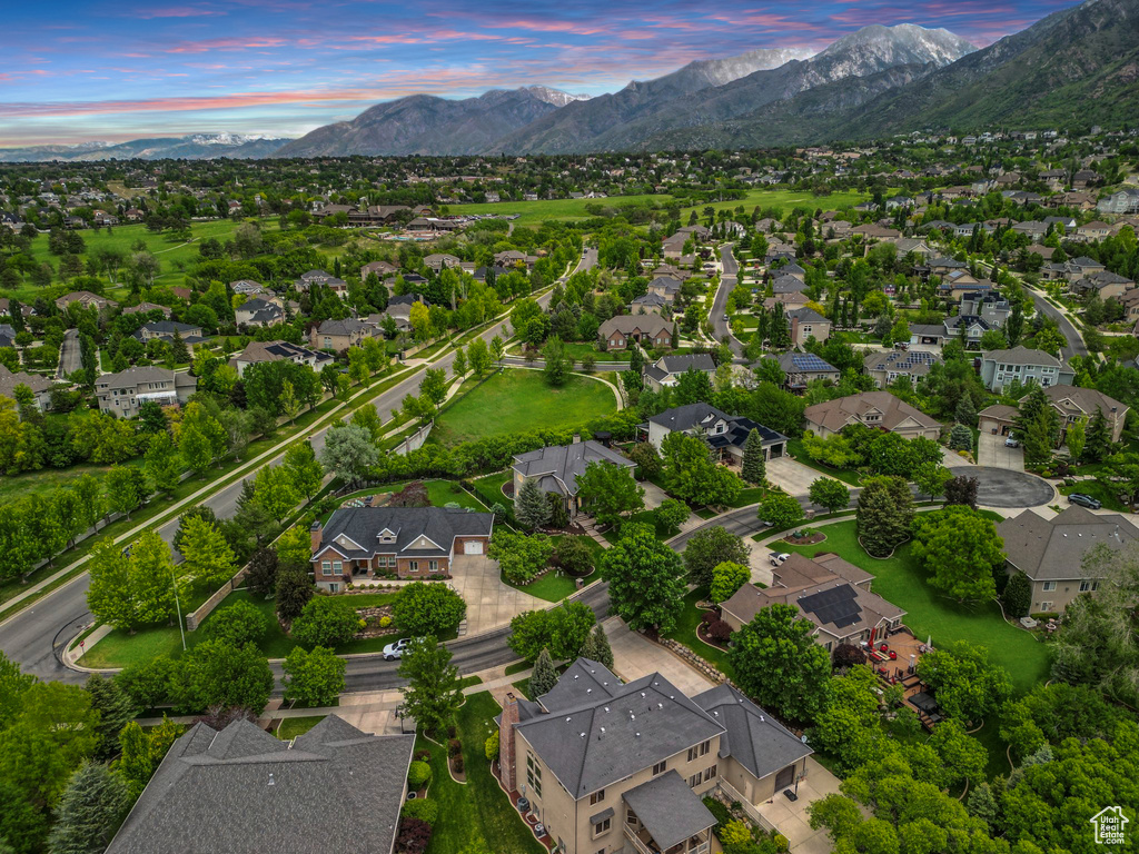 View of property location with mountains and nearby suburban area