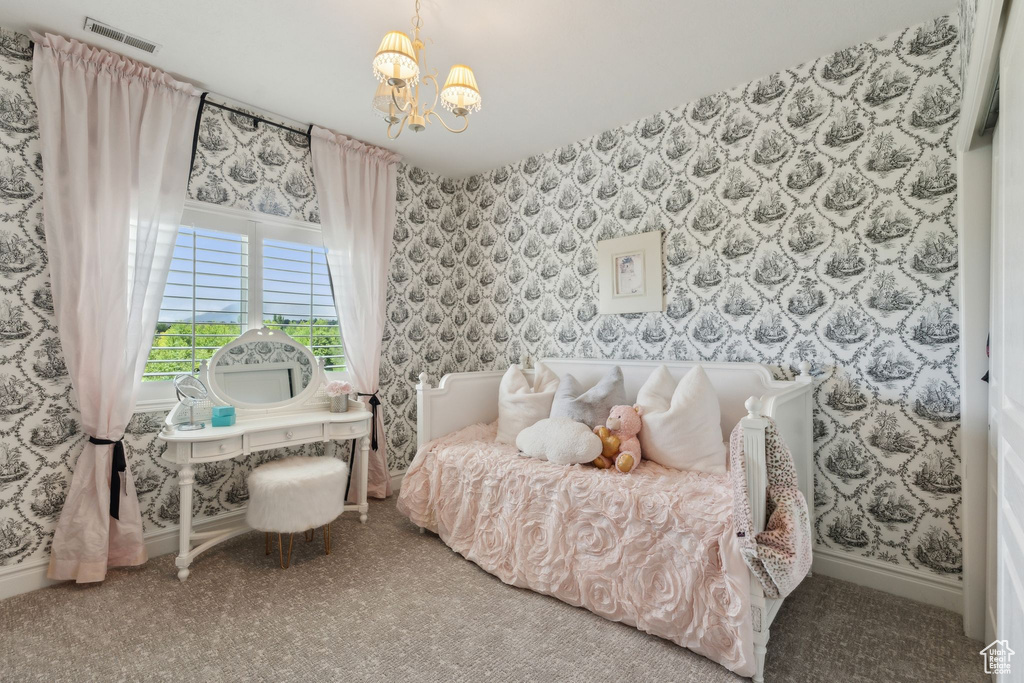 Bedroom featuring wallpapered walls, a chandelier, carpet, and baseboards
