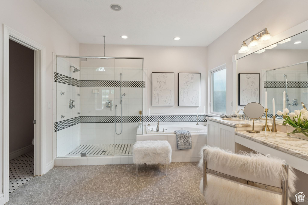 Full bathroom with a shower stall, a bath, vanity, and recessed lighting