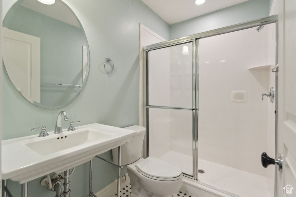 Full bathroom with a shower with shower door, toilet, and recessed lighting