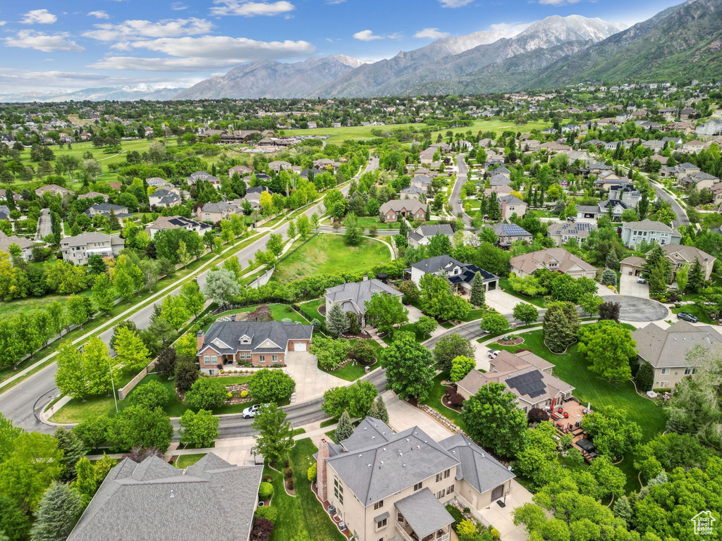 Aerial view of residential area featuring a mountain backdrop