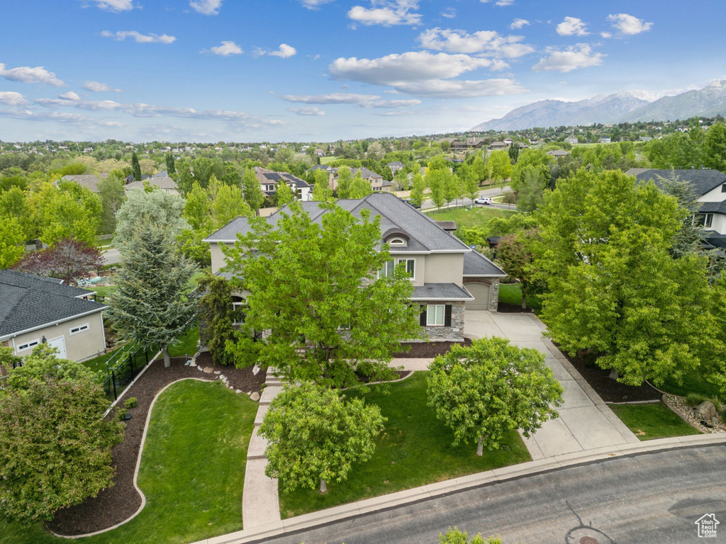 Aerial perspective of suburban area featuring a mountain backdrop