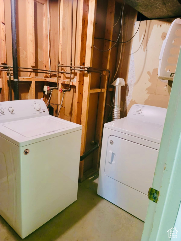 Laundry room with washing machine and clothes dryer