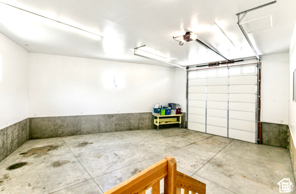 Garage featuring a garage door opener