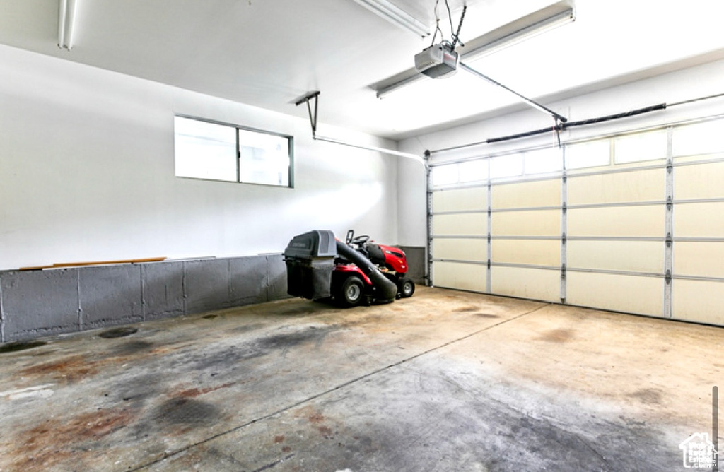 Garage featuring a garage door opener
