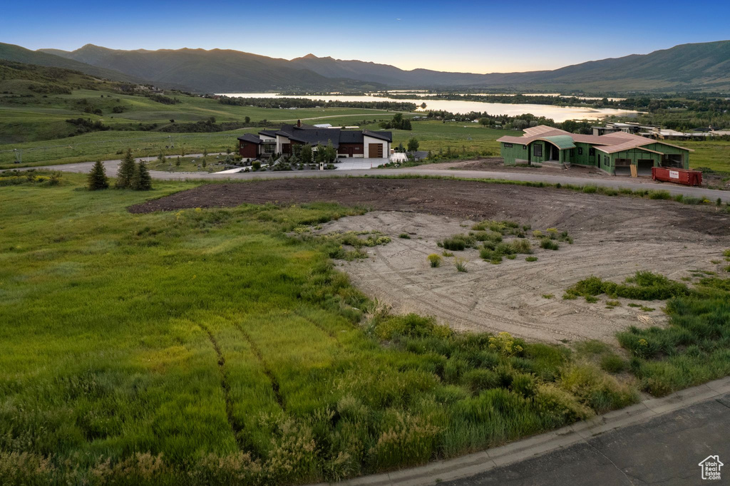 View of mountain backdrop with rural landscape