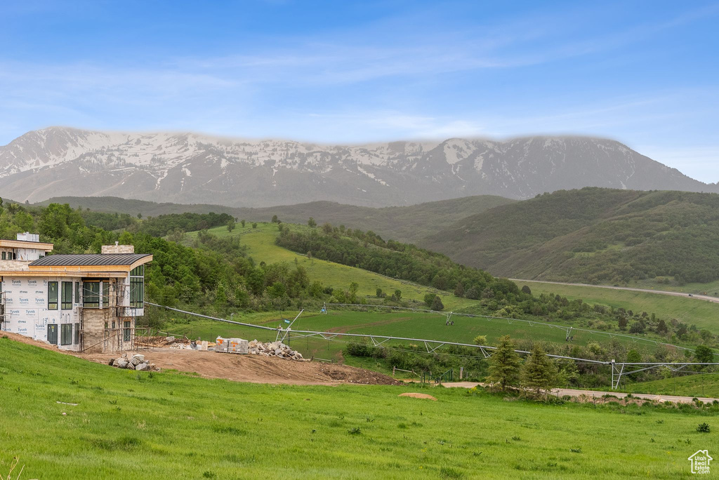 View of mountain backdrop with rural landscape