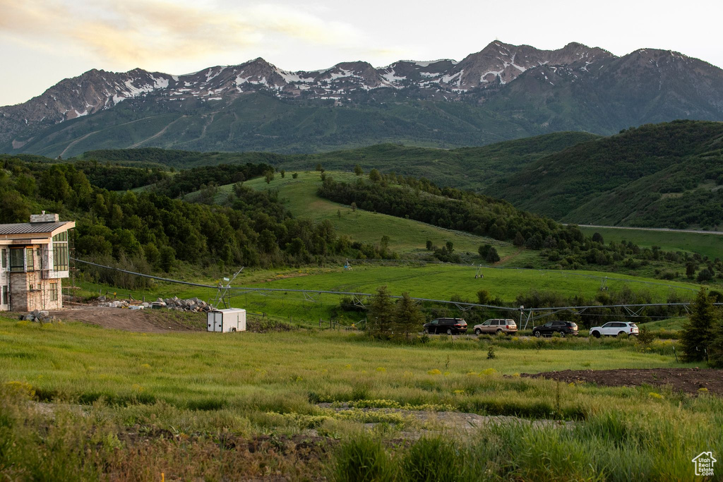 View of mountain background featuring rural landscape