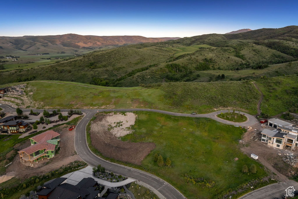 Aerial view of property's location with a mountainous background