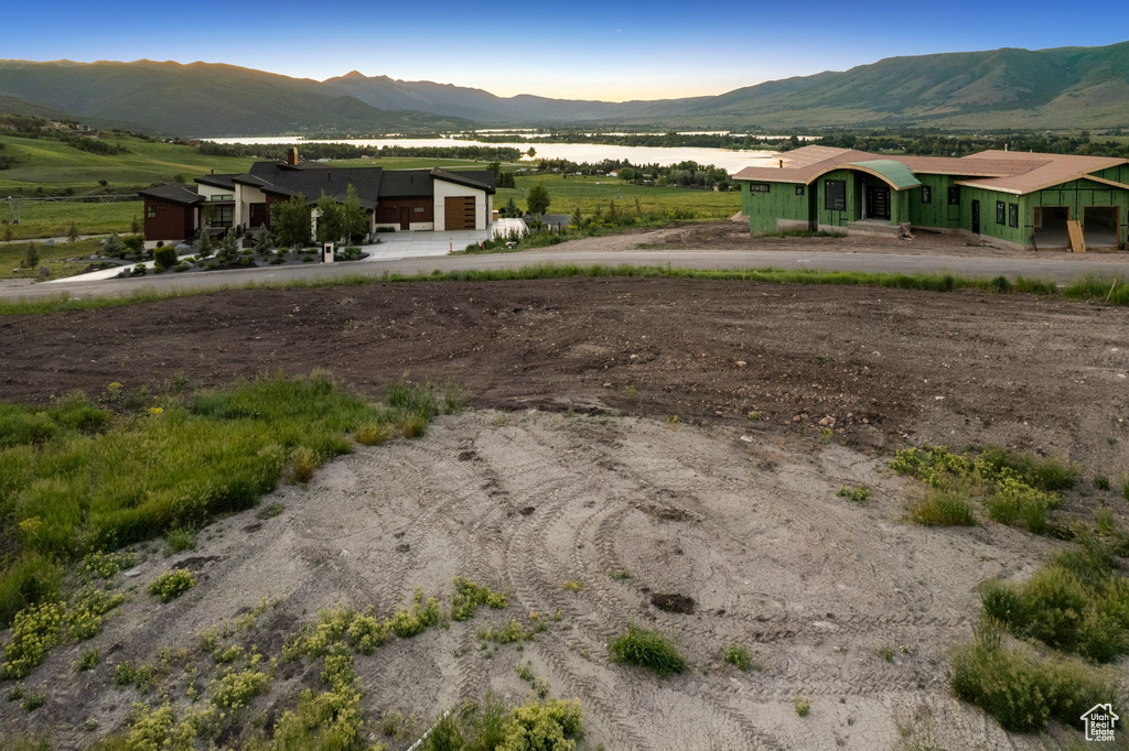 View of mountain backdrop featuring rural landscape