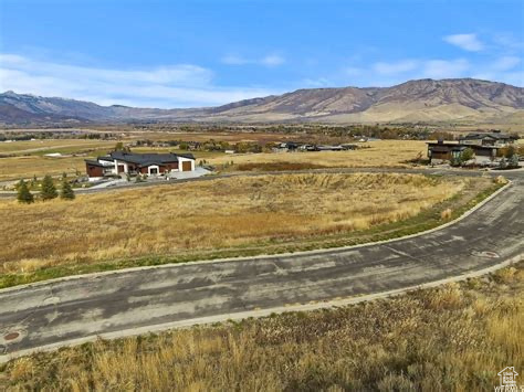 View of mountain backdrop with rural landscape