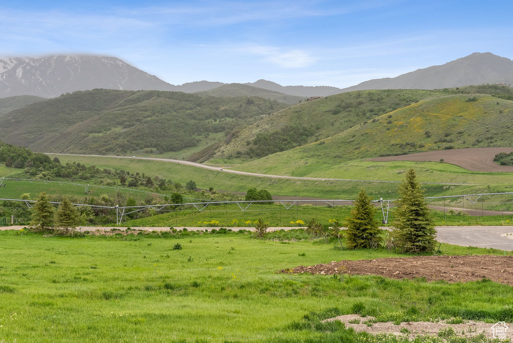 View of mountain background featuring rural landscape