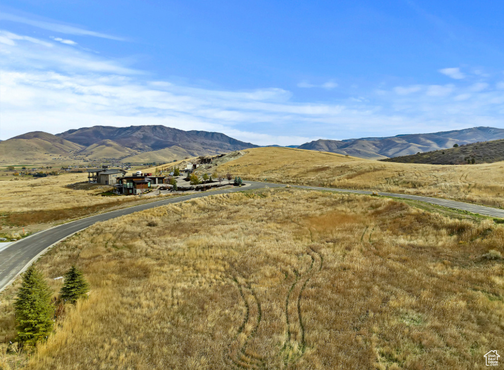 View of mountain background featuring rural landscape