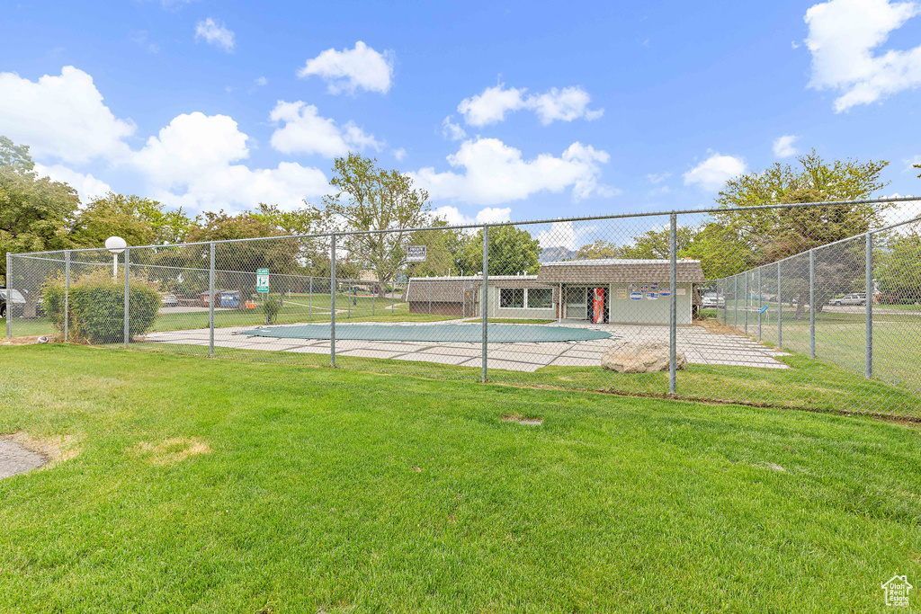 View of tennis court featuring community basketball court