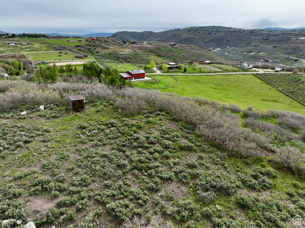 View of mountain background featuring rural landscape