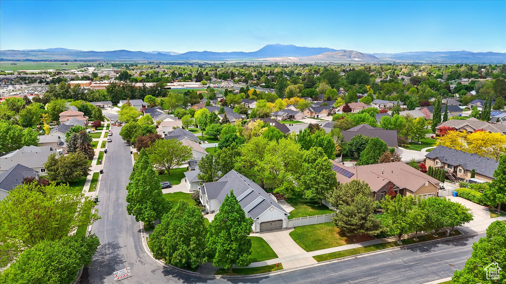 Aerial perspective of suburban area with a mountain backdrop