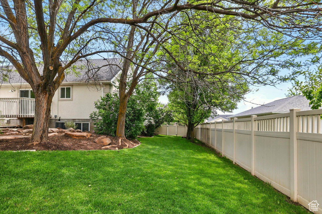 View of yard with central AC unit