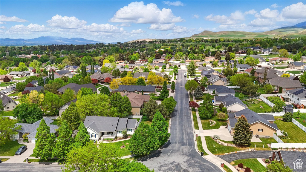 Aerial perspective of suburban area with a mountain backdrop