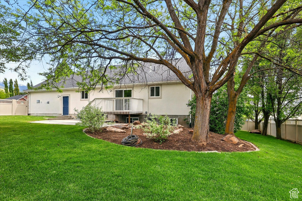 Back of property featuring stucco siding