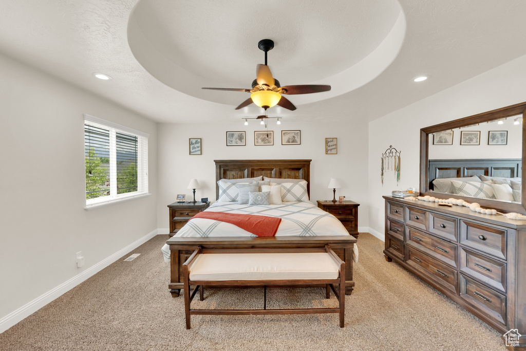 Bedroom with light colored carpet, baseboards, recessed lighting, and ceiling fan