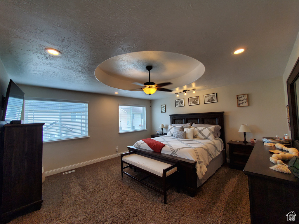 Bedroom with carpet flooring, baseboards, recessed lighting, a ceiling fan, and a textured ceiling