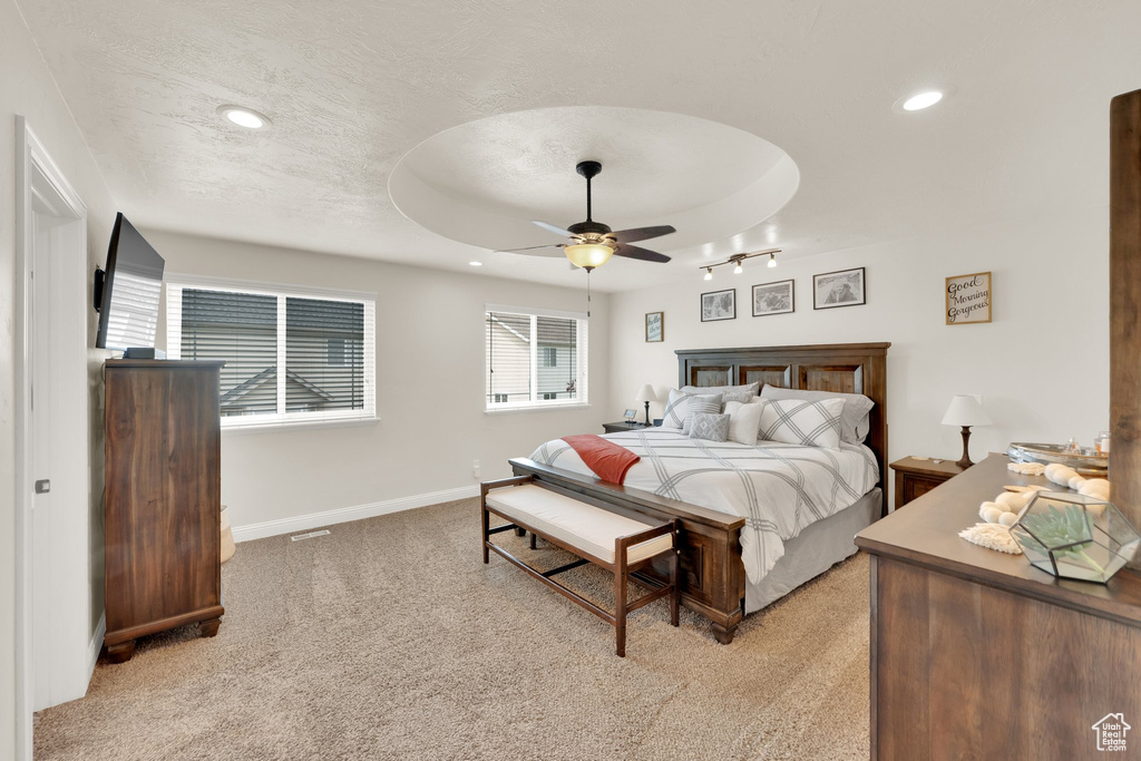 Bedroom with light carpet, recessed lighting, baseboards, and a ceiling fan
