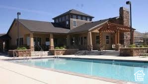 Community pool featuring a patio area