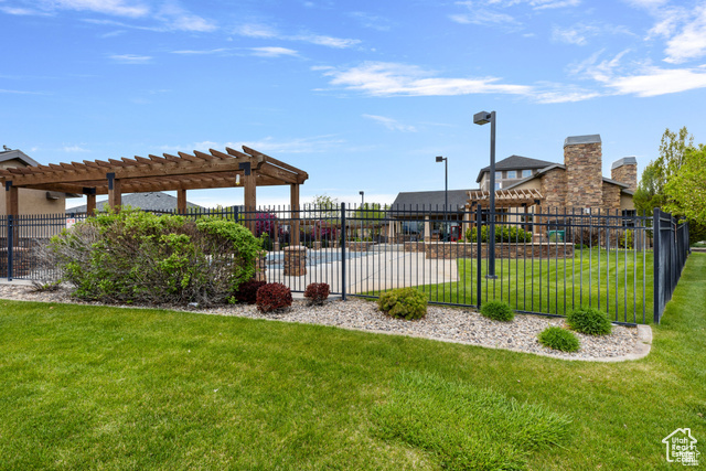 Surrounding community featuring a pergola