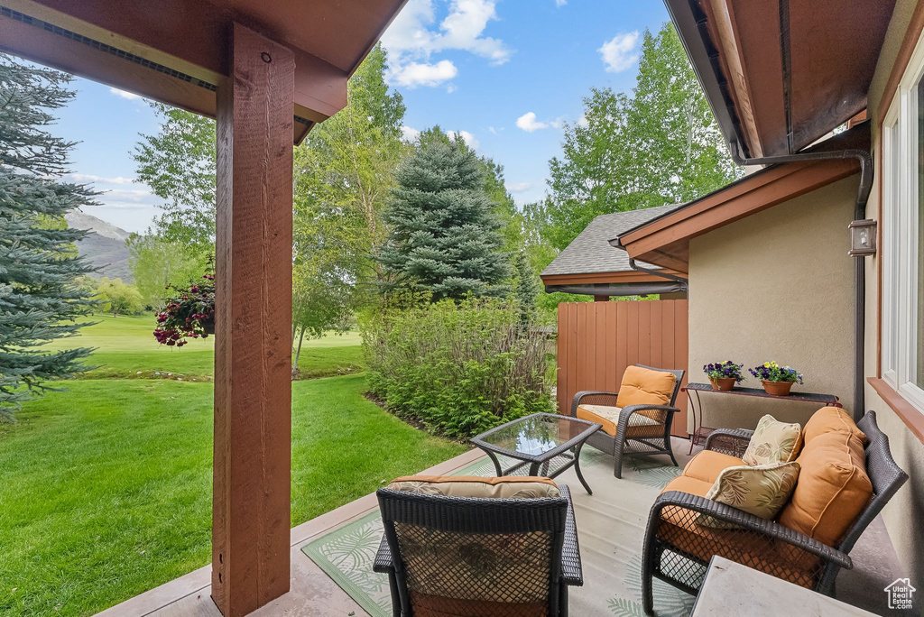 View of patio with an outdoor hangout area