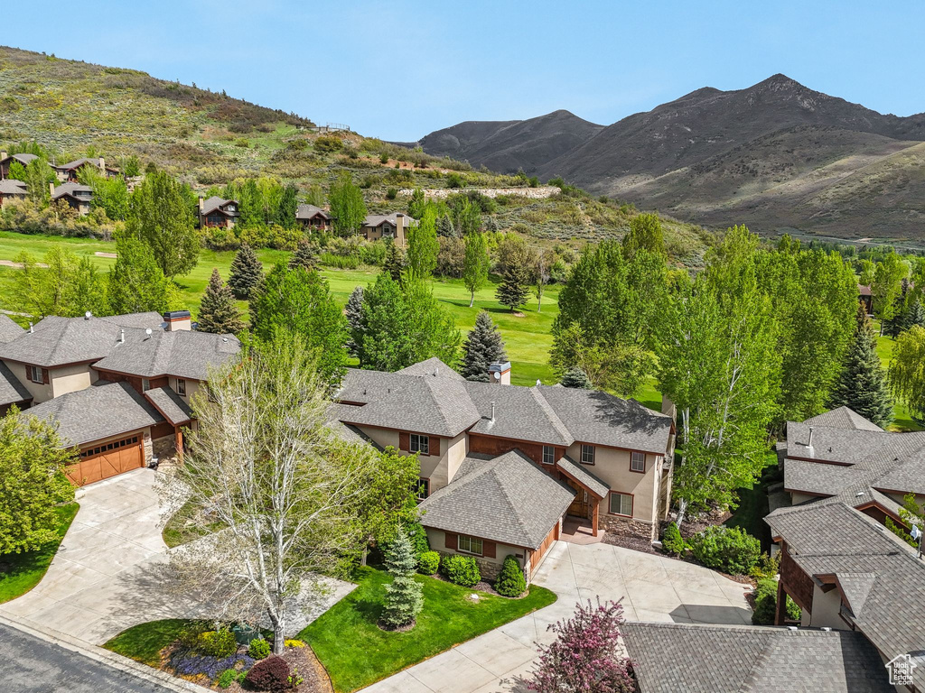 Aerial perspective of suburban area featuring a mountainous background