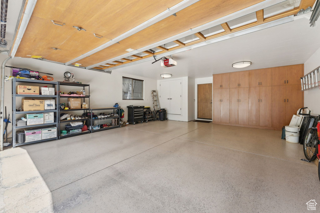 Garage featuring a garage door opener