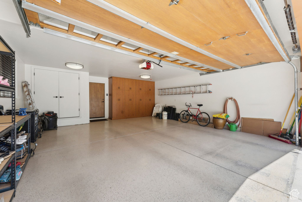 Garage featuring a garage door opener
