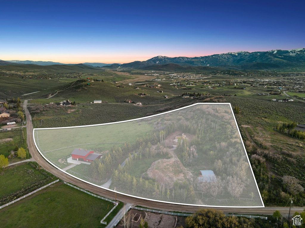 View of rural area featuring property parcel outlined and mountains