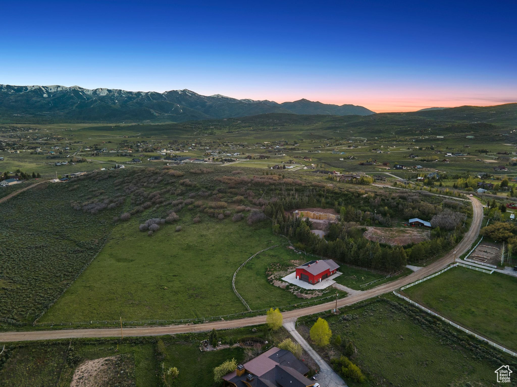 Aerial view at dusk of a mountain view and a view of countryside