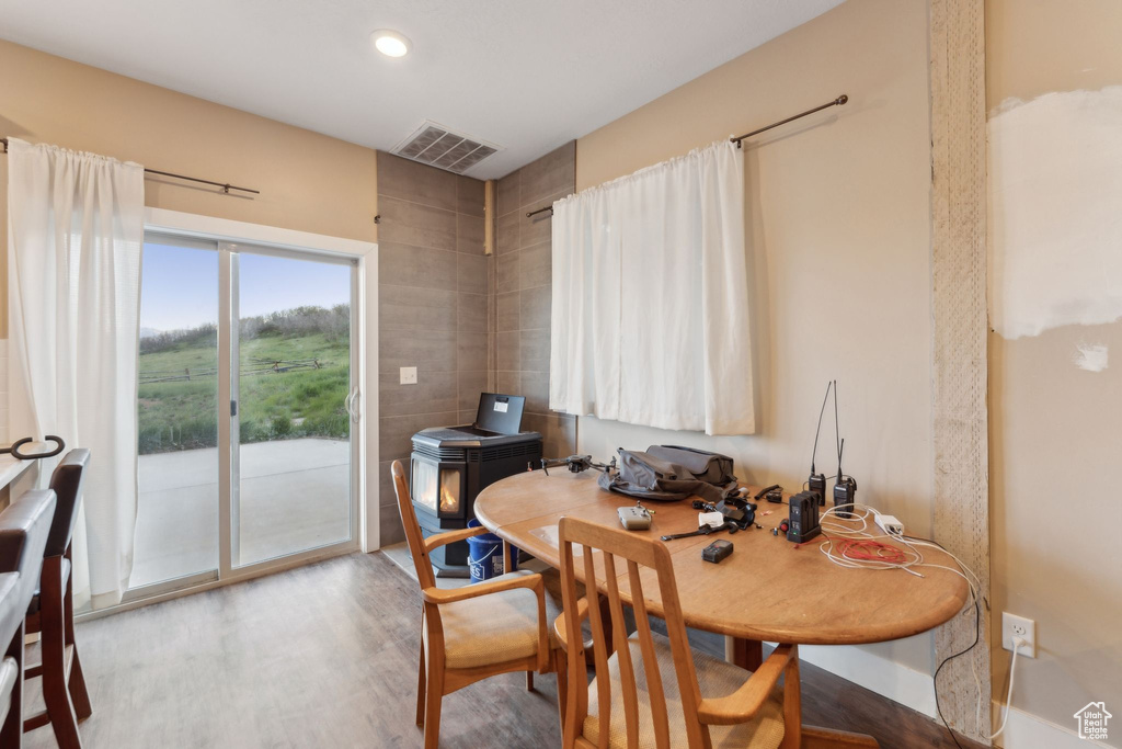 Dining room featuring wood finished floors and recessed lighting