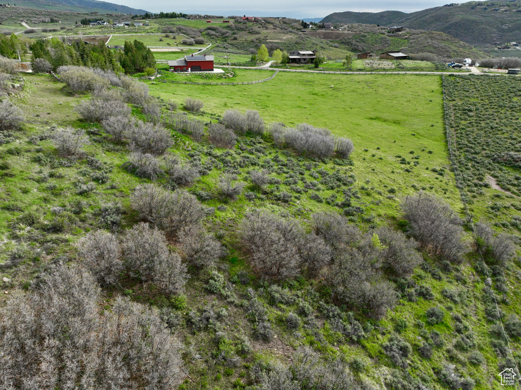 View of mountain backdrop with rural landscape