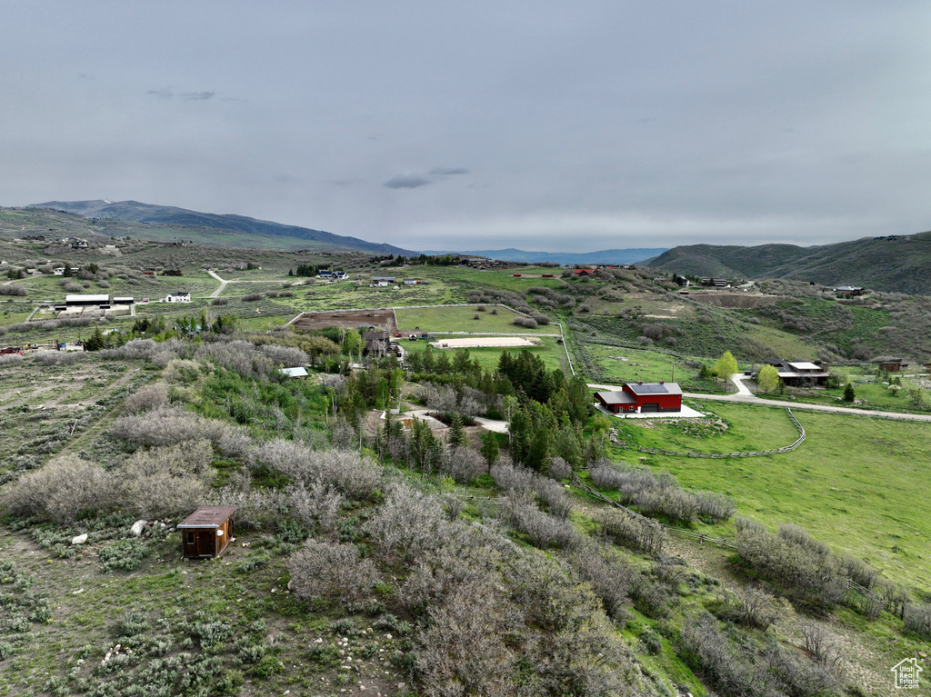 View of mountain backdrop featuring rural landscape