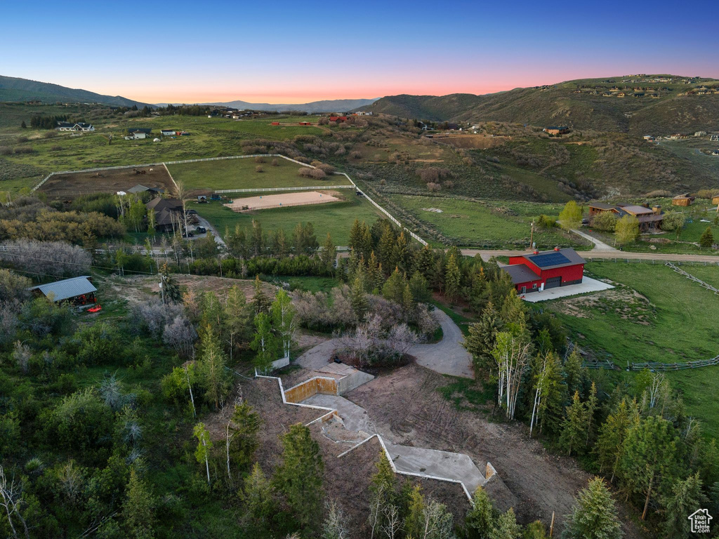 Aerial view of property and surrounding area with rural landscape and mountains