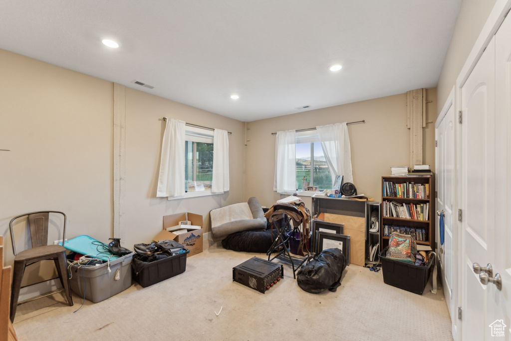 Sitting room with carpet floors and recessed lighting