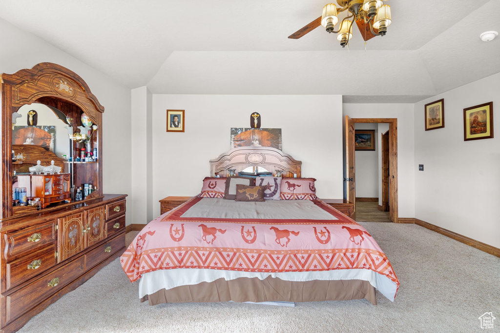 Bedroom with carpet, baseboards, and ceiling fan